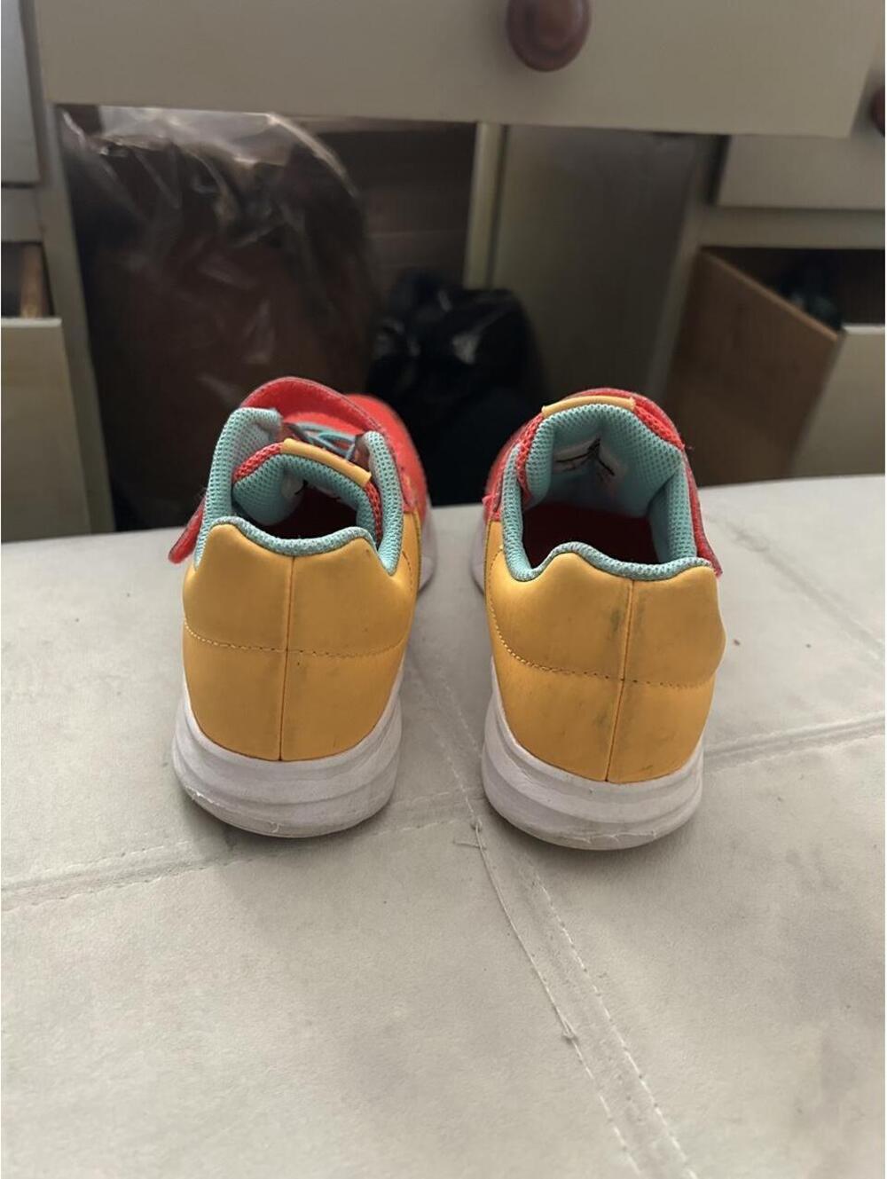 Nike kids sneakers in red, yellow, and teal with a teal Nike swoosh, size US 2 - Picture 4 of 7
